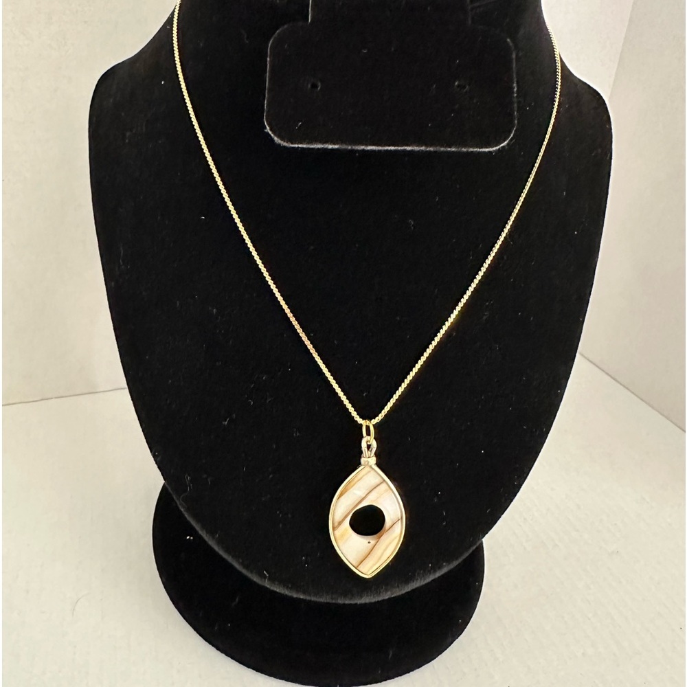 Cream and brown gold tone metal wrapped pendant on gold tone necklace - Picture 1 of 6
